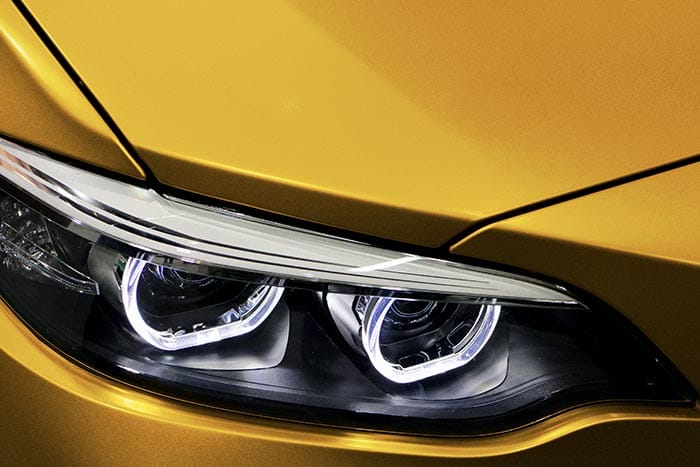 Headlight of yellow car