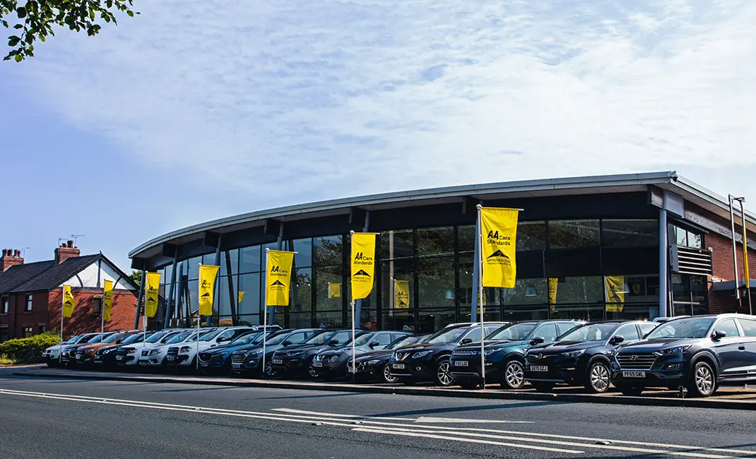 Car dealership flying AA Cars Standards flags outside