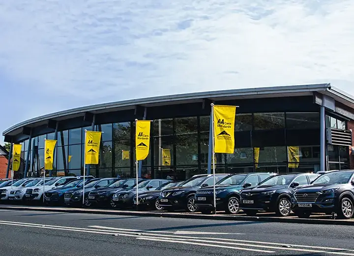 Car dealership flying AA Cars Standards flags outside